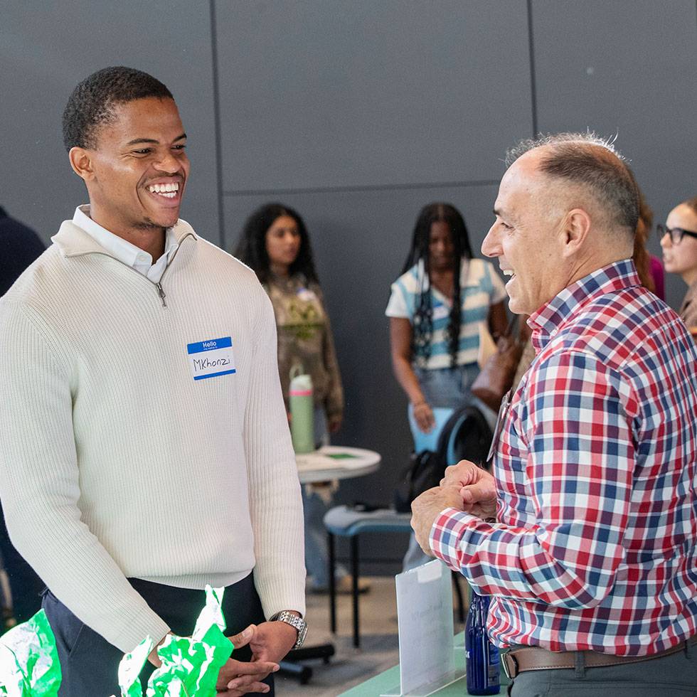 A Skidmore student speaks with an alumni mentor during Career Jam, an on-campus networking event that connects students with accomplished graduates for career advice and mentorship.