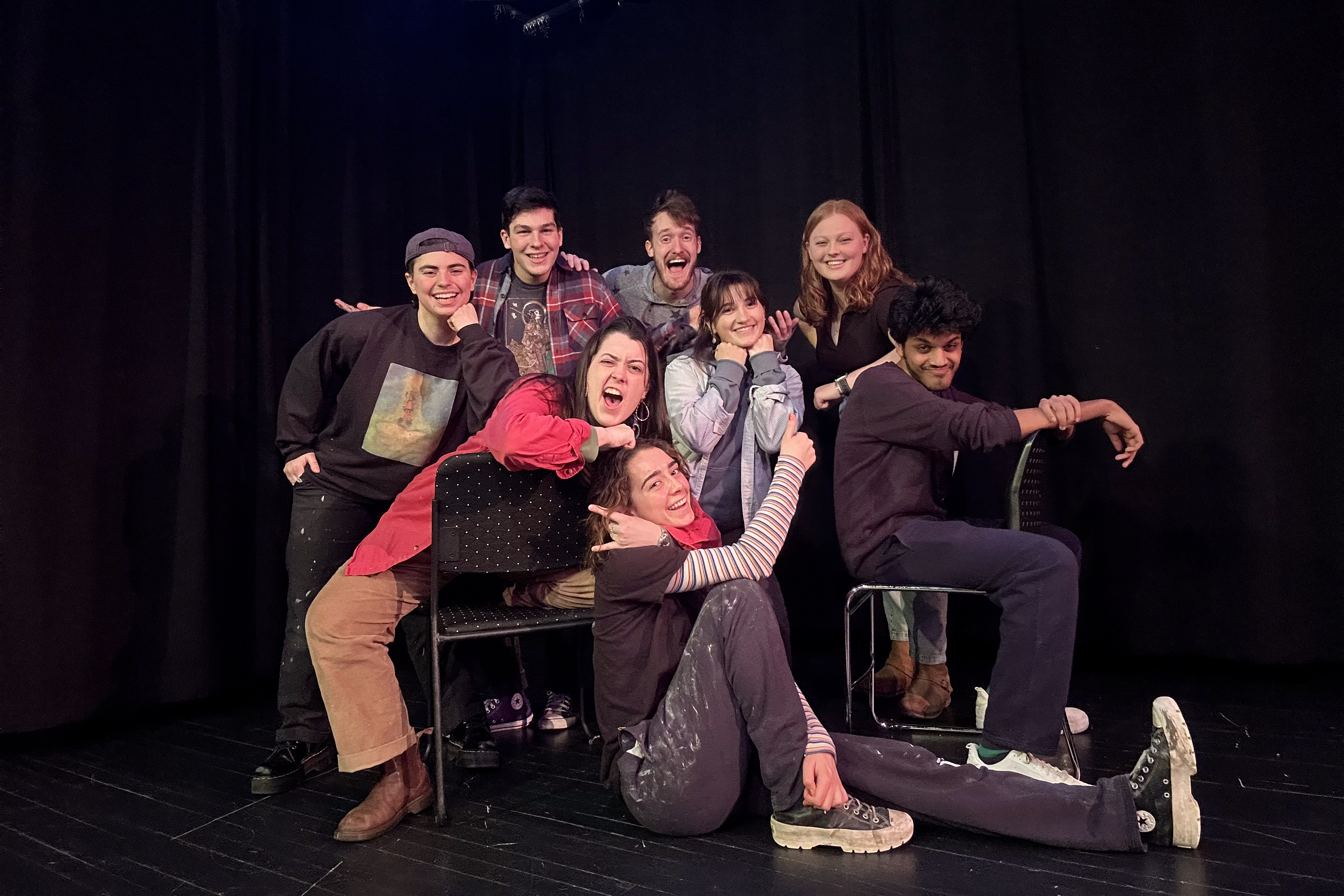 Elise Milner ’25, seated on the floor, is a member of Skidomedy, one of several Skidmore student clubs dedicated to comedy.