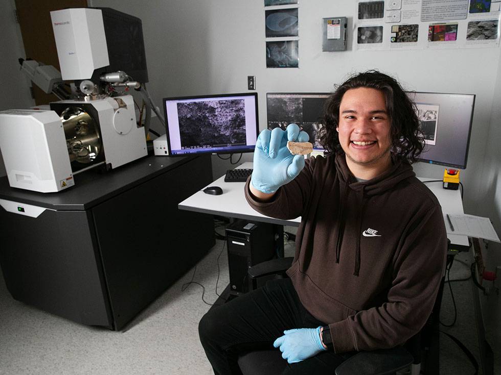 Skidmore College student Leo Parra ’24, an anthropology and chemistry double major, works on research in the  SMIC Lab in the Billie Tisch Center for Integrated Sciences