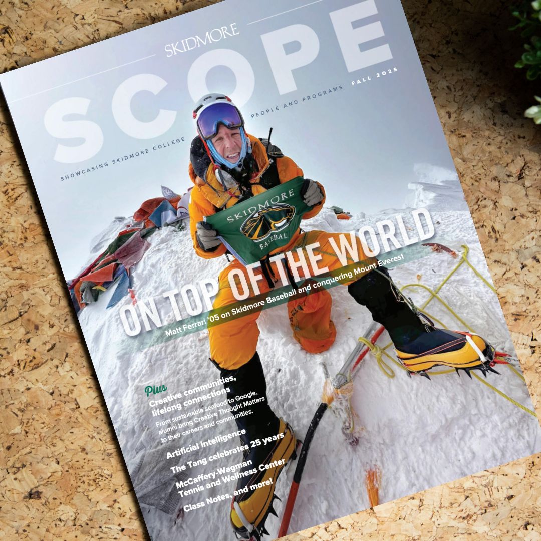 Image of the cover of Scope magazine featuring an alumnus at the top of Mount Everest holding a Skidmore flag.