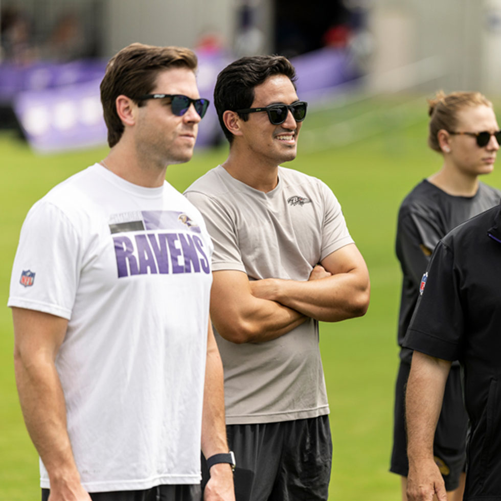 Derrick Yam '17 stands on the Baltimore Raven's football field