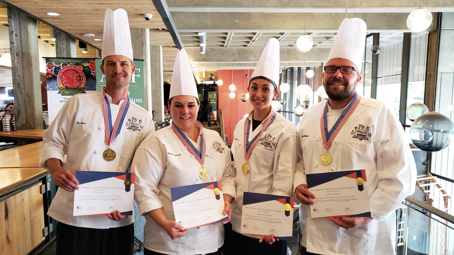 Members of Skidmore's dining services team pose with their awards after a culinary competition 
