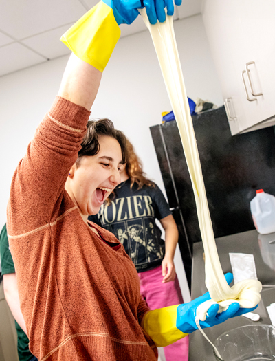 Georgia Frazier '29 and classmates in the Gardenside Living-Learning Community make mozzarella in the kitchen of the new Billie Tisch Center for Integrated Sciences.