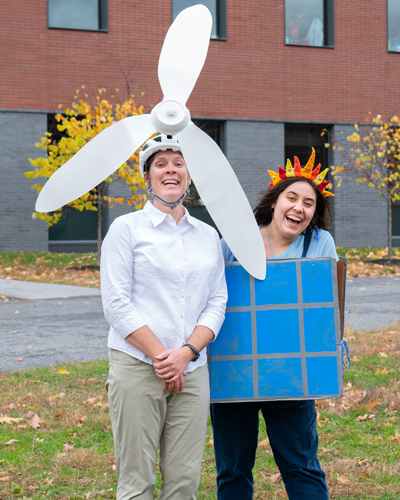 Director of Sustainability and Environmental Initiatives Tarah Rowse and Sustainability Coordinator Celia Darling dressed as a wind turbine and a solar panel, respectively