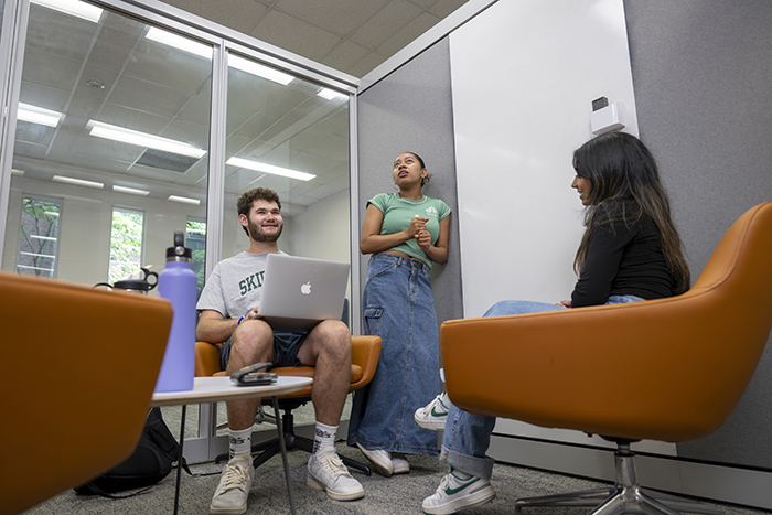  Milo Flamenbaum ’26 with two other Skidmore students