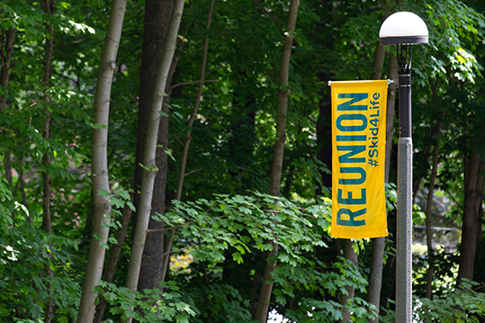Reunion Banner in front of trees