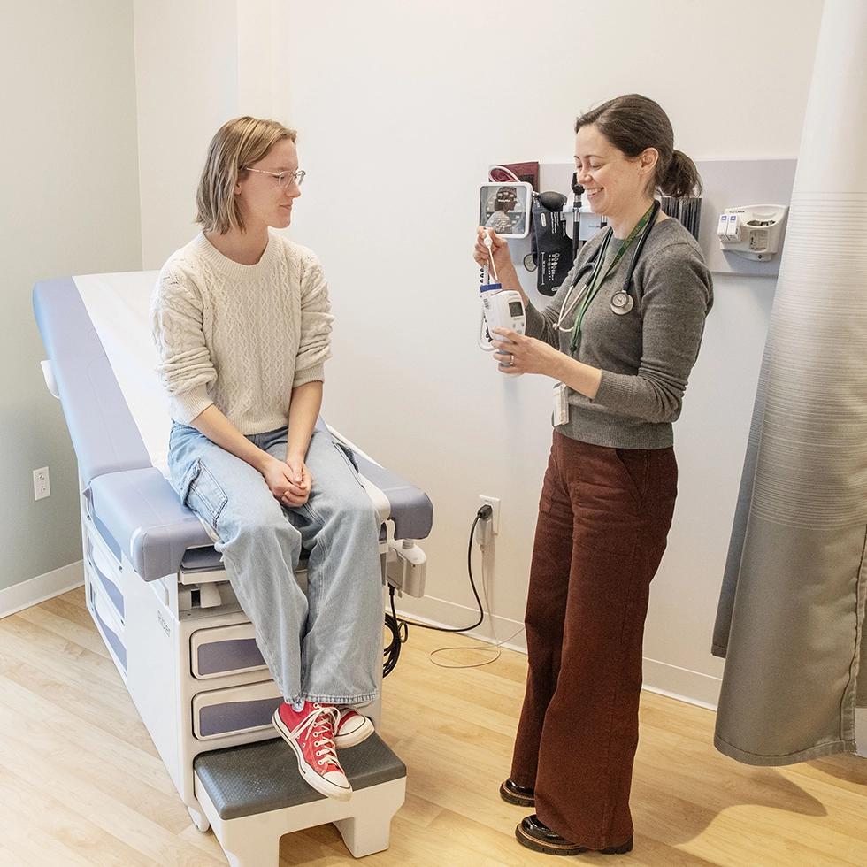 A nurse takes a Skidmore student’s vitals during a routine appointment in the campus health services center.